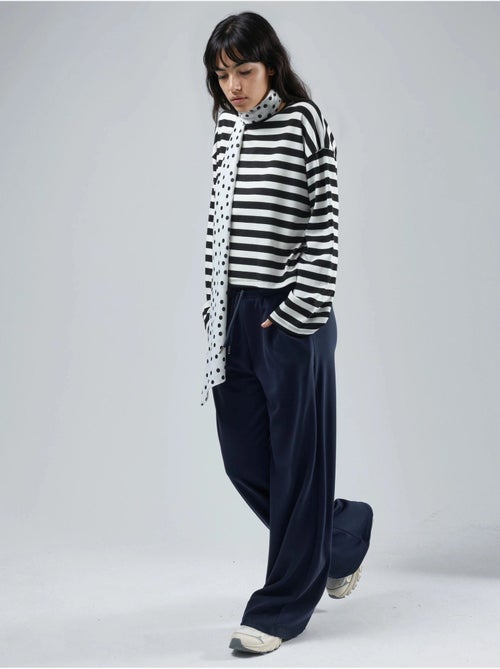Pantalon en maille taille haute et jambes larges busem - Kiabi Pantalon en maille taille haute et jambes larges busem - Kiabi