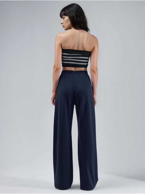 Pantalon en maille taille haute et jambes larges busem - Kiabi Pantalon en maille taille haute et jambes larges busem - Kiabi