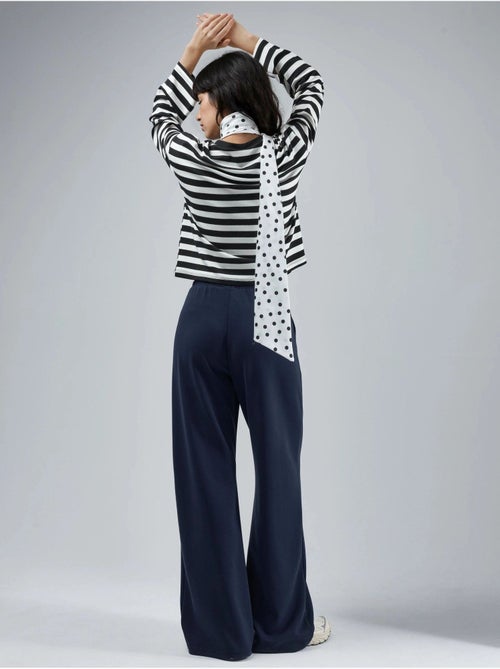 Pantalon en maille taille haute et jambes larges busem - Kiabi Pantalon en maille taille haute et jambes larges busem - Kiabi