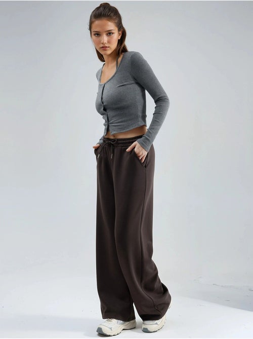 Pantalon en maille taille haute et jambes larges busem - Kiabi Pantalon en maille taille haute et jambes larges busem - Kiabi