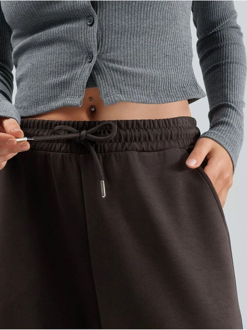 Pantalon en maille taille haute et jambes larges busem - Kiabi Pantalon en maille taille haute et jambes larges busem - Kiabi