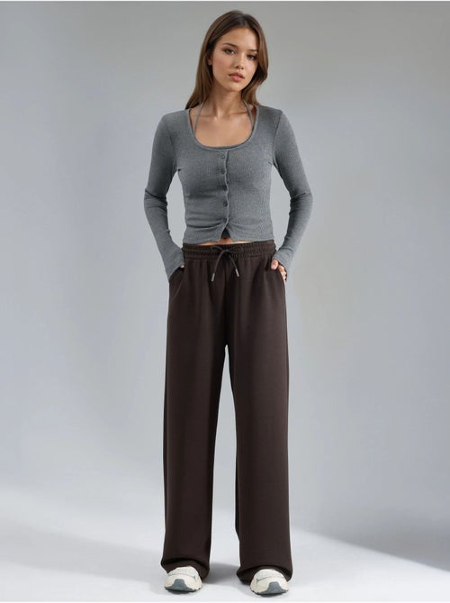 Pantalon en maille taille haute et jambes larges busem - Kiabi Pantalon en maille taille haute et jambes larges busem - Kiabi
