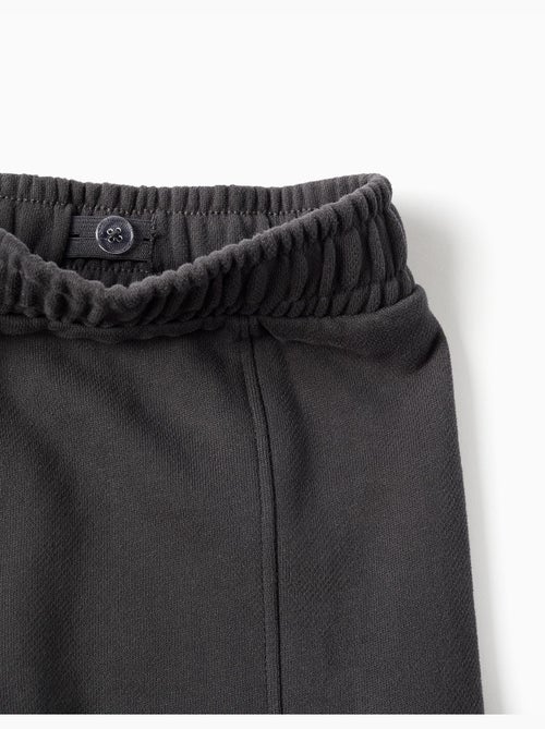 Pantalon en molleton à jambe large avec poches cargo - Kiabi Pantalon en molleton à jambe large avec poches cargo - Kiabi