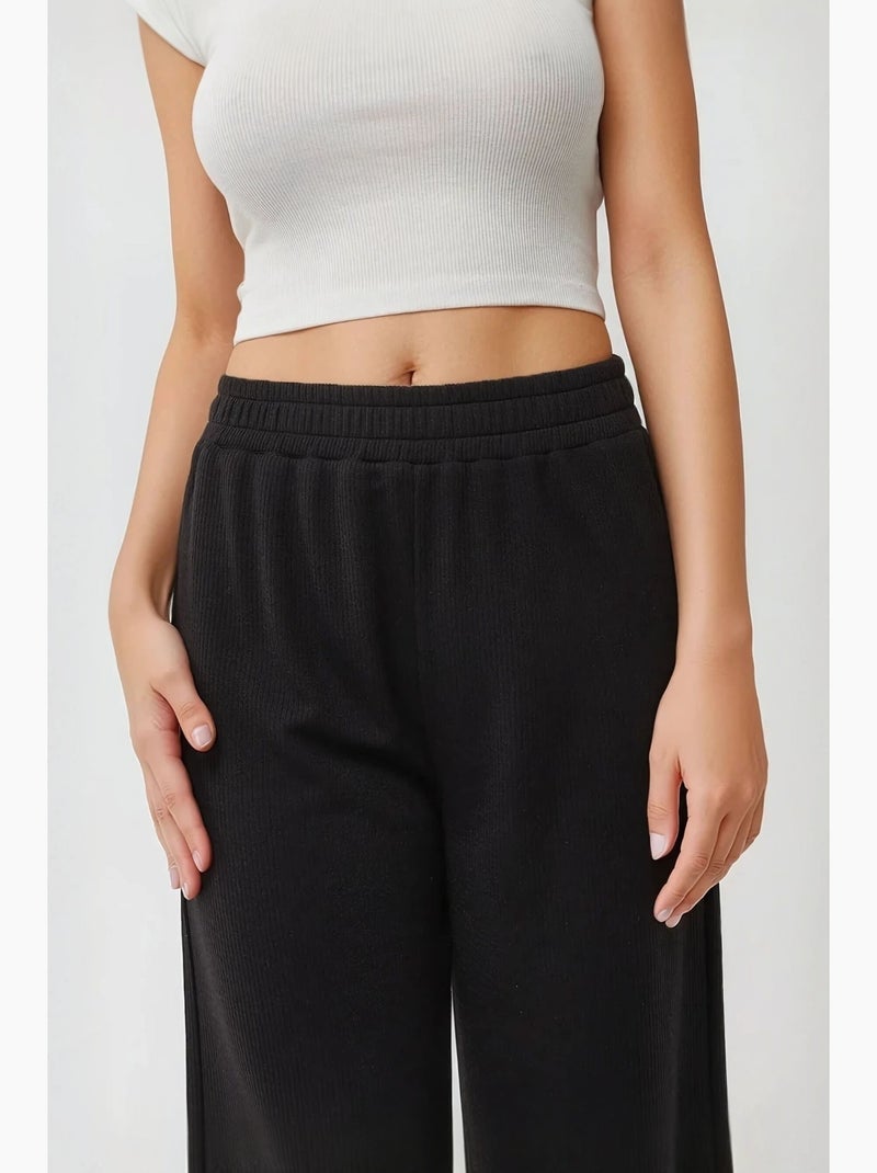 Pantalon en tricot à jambes larges avec taille élastique hiccup Noir - Kiabi
