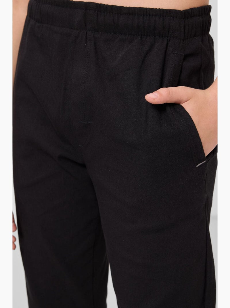 Pantalon enfant à jambe droite tommy Noir - Kiabi