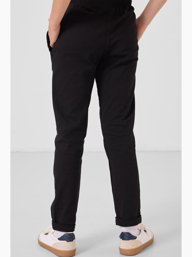 Pantalon enfant à jambe droite tommy Noir - Kiabi
