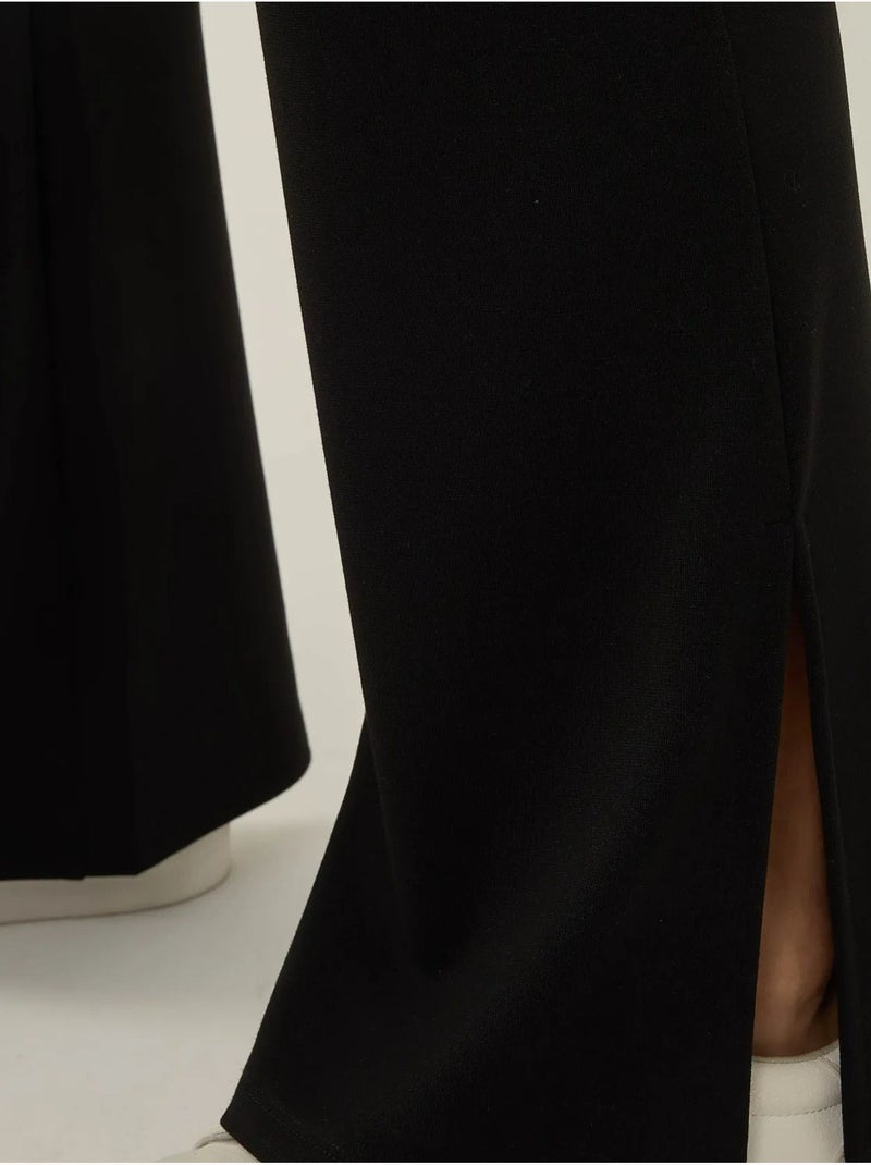 Pantalon évasé taille haute avec fente Noir - Kiabi
