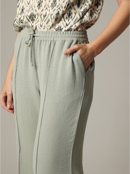 Pantalon fluide en tissu texturé avec taille élastiquée et double couture verticale 'Deeluxe' - Kiabi