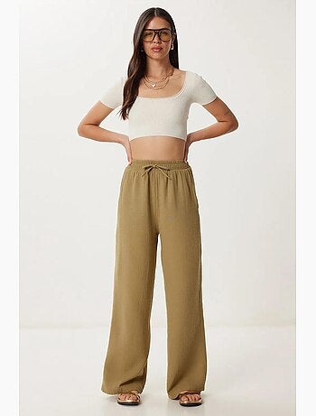 Pantalon jambes larges, taille élastique, cordon de serrage, finitions bordées istanbul