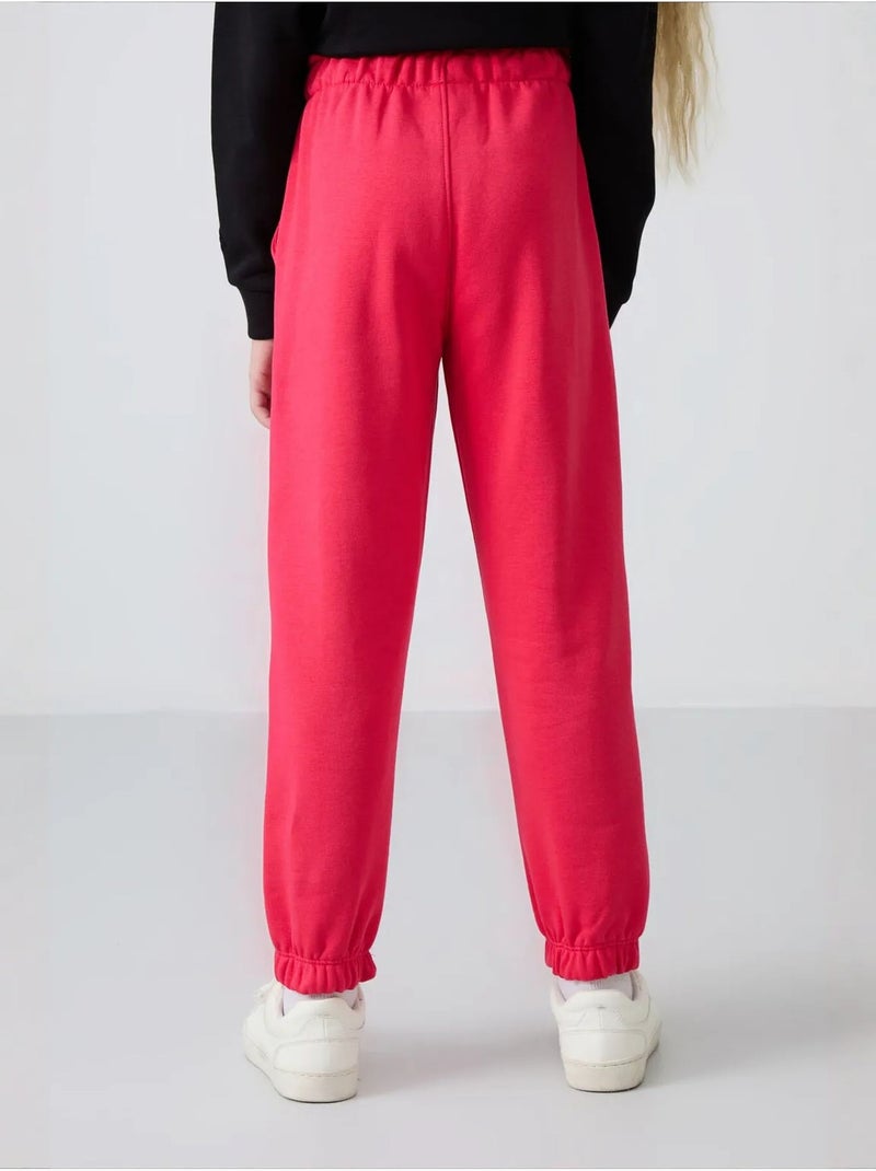 Pantalon jeune à taille cordon tommy Rose fluo/Solinotes - Kiabi
