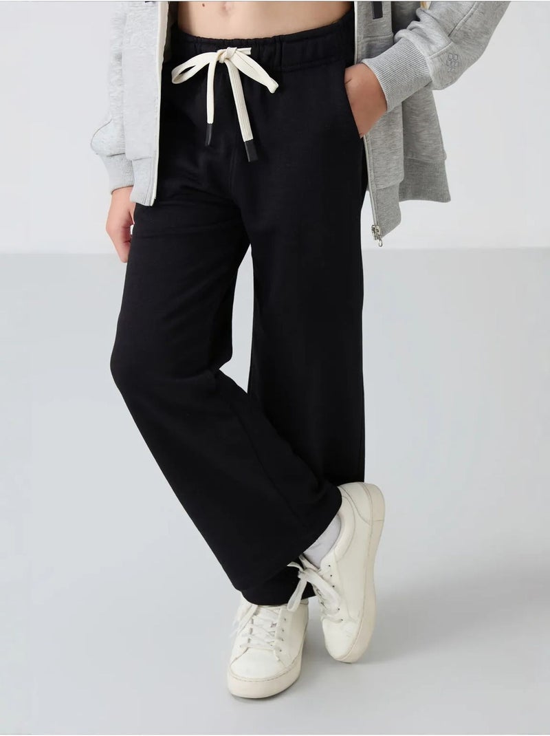 Pantalon jeunesse à cordon tommy Noir - Kiabi
