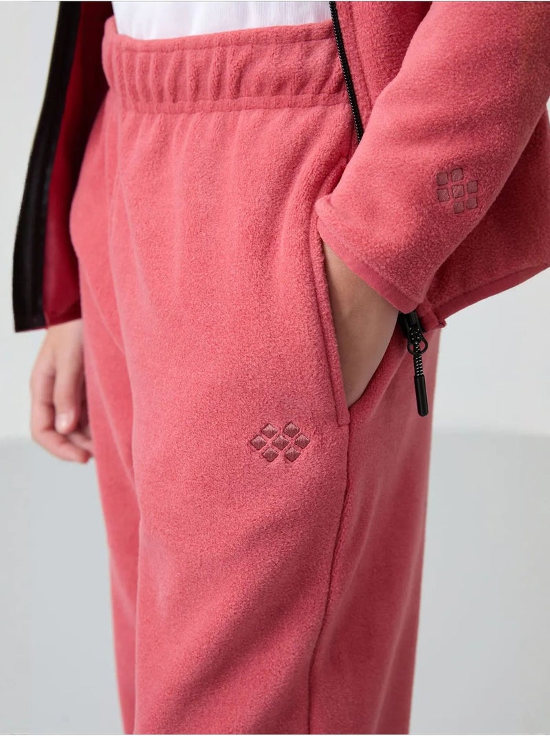 Pantalon jeunesse uni tommy Magenta - Kiabi