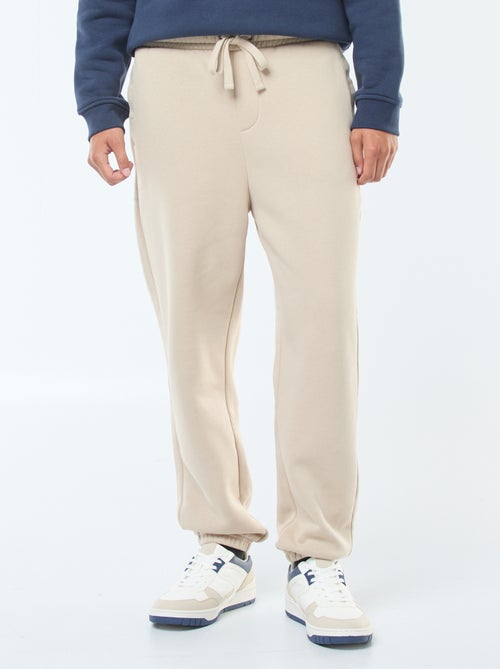 Pantalon jogging uni avec cordons de serrage à la taille - Kiabi Pantalon jogging uni avec cordons de serrage à la taille - Kiabi