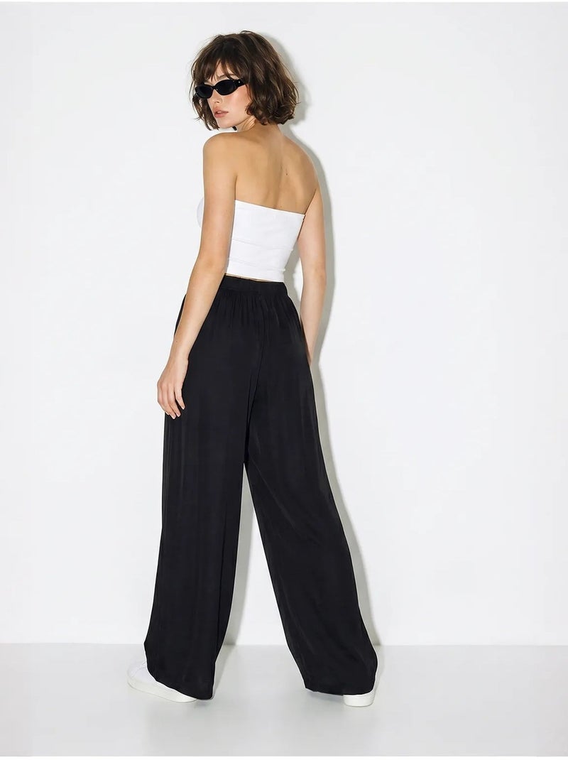 Pantalon large à taille élastique lucci Noir - Kiabi