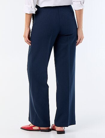 Pantalon large avec boutons dorés fantaisies sur les poches