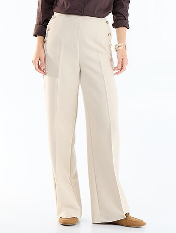 Pantalon large avec boutons dorés fantaisies sur les poches
