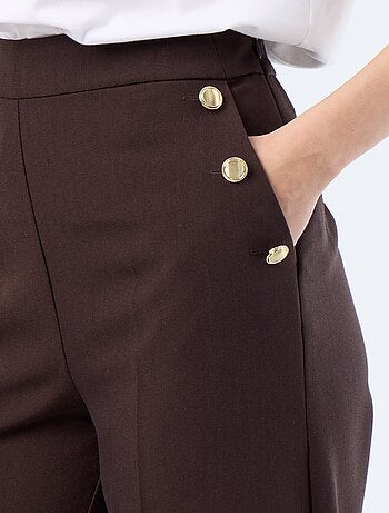 Pantalon large avec boutons dorés fantaisies sur les poches