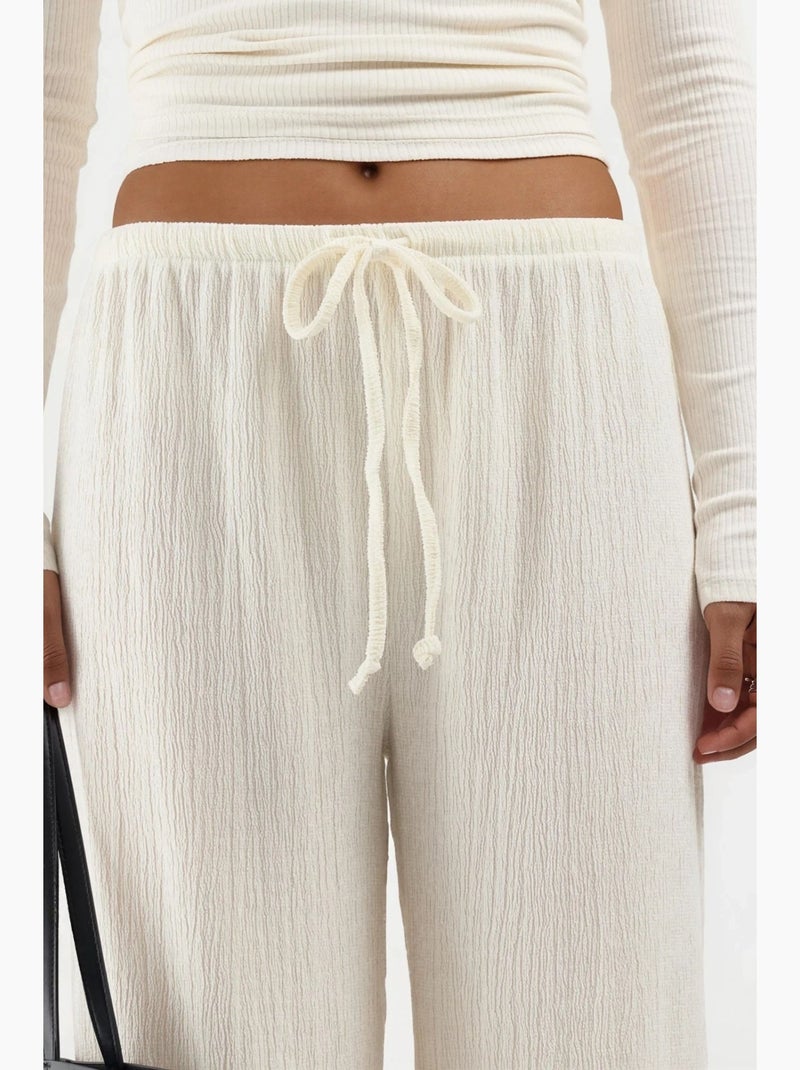 Pantalon large avec cordon de serrage à la taille busem Crème - Kiabi
