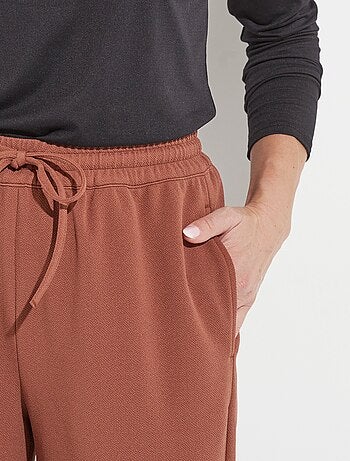 Pantalon large ceinture élastiquée maille crêpe unie
