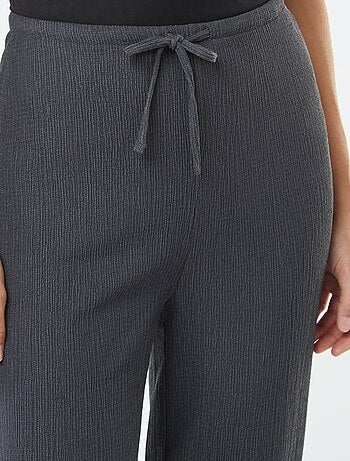 Pantalon large en maille plissée