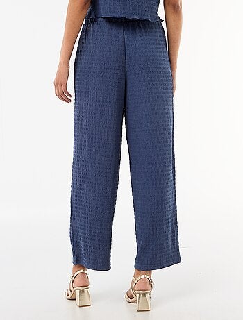 Pantalon large en maille smockée