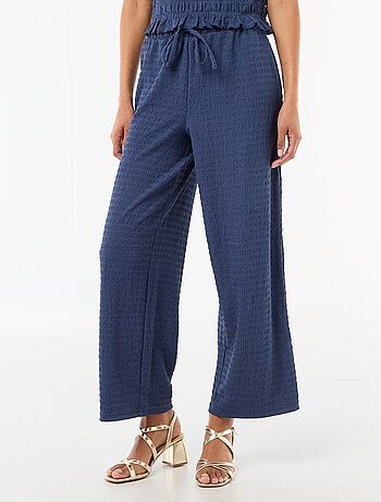 Pantalon large en maille smockée