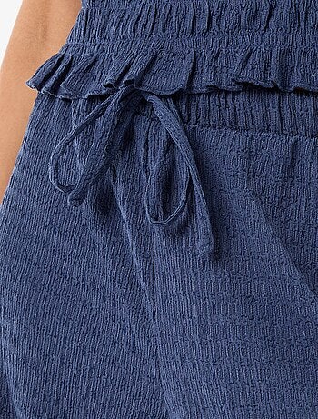 Pantalon large en maille smockée