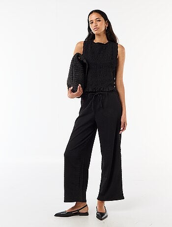 Pantalon large en maille smockée