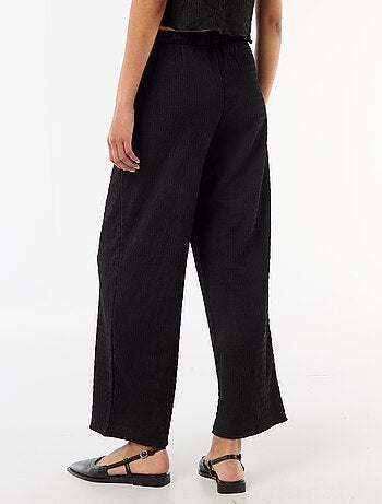 Pantalon large en maille smockée
