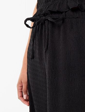 Pantalon large en maille smockée