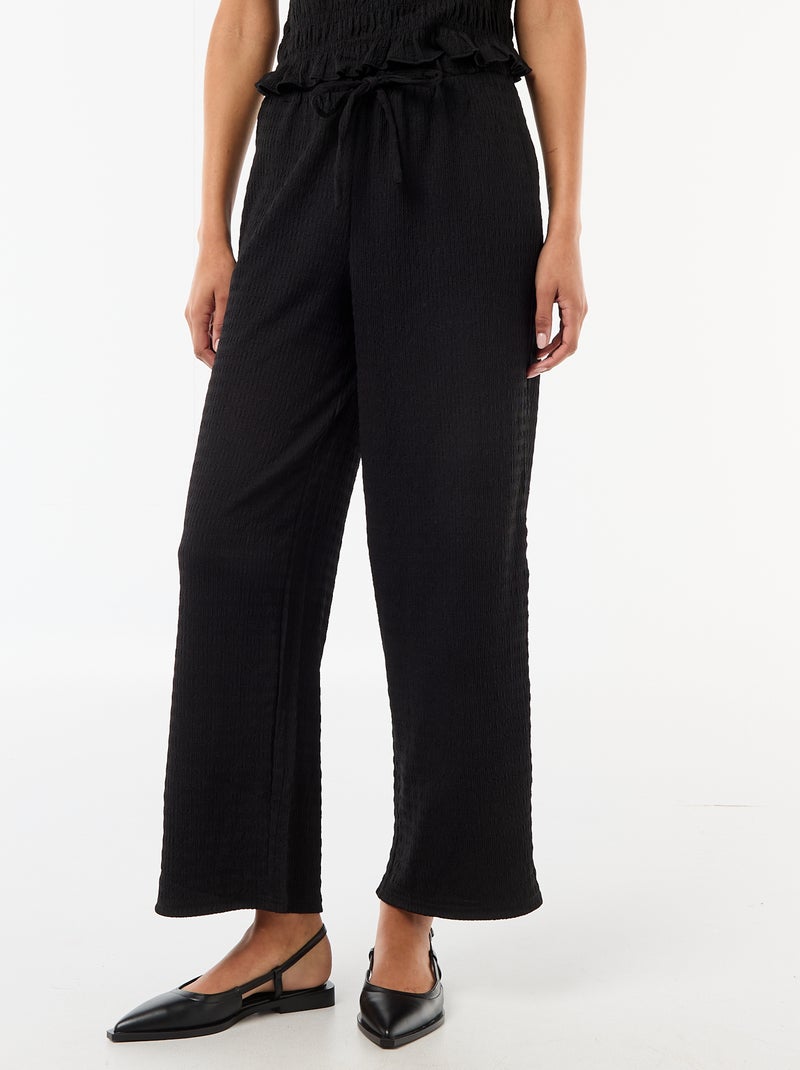 Pantalon large en maille smockée Noir - Kiabi