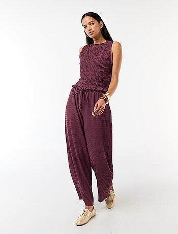 Pantalon large en maille smockée