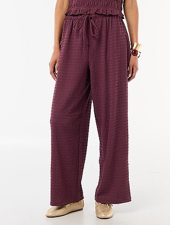Pantalon large en maille smockée
