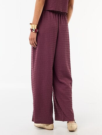 Pantalon large en maille smockée