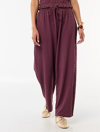 Pantalon large en maille smockée