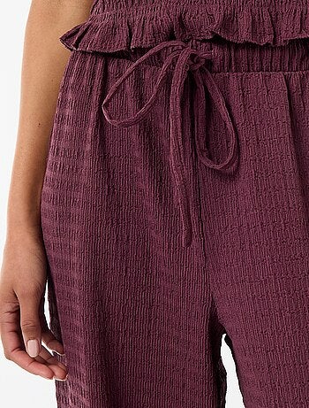 Pantalon large en maille smockée