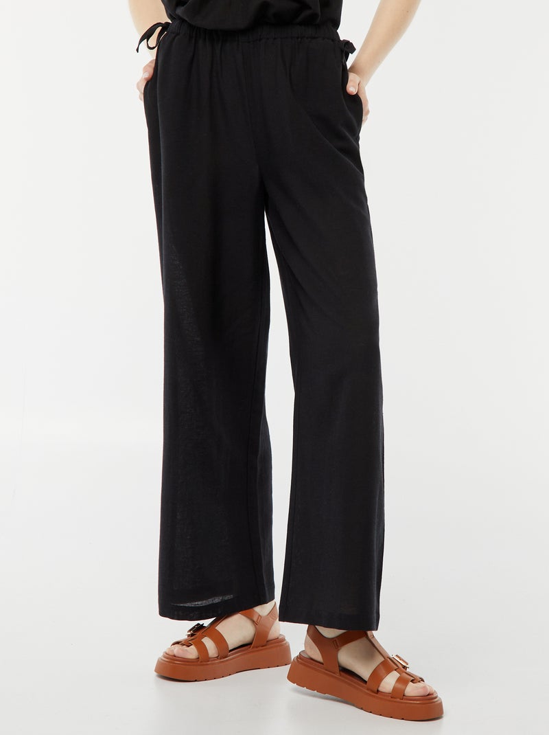 Pantalon large et fluide avec motif noir - Kiabi