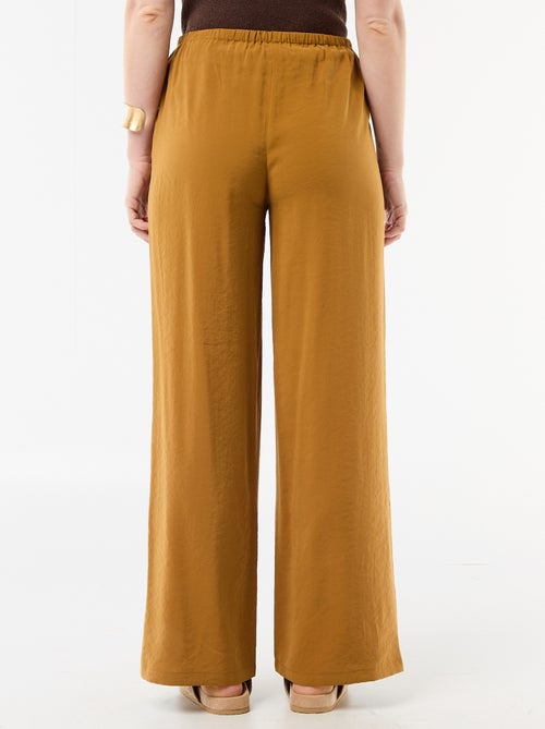 Pantalon large femme à taille élastiquée et lien à nouer - Kiabi Pantalon large femme à taille élastiquée et lien à nouer - Kiabi