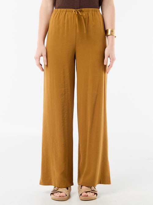 Pantalon large femme à taille élastiquée et lien à nouer - Kiabi Pantalon large femme à taille élastiquée et lien à nouer - Kiabi