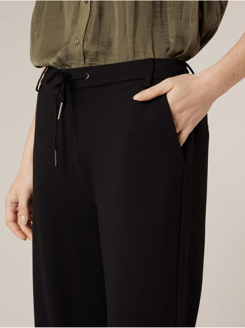 Pantalon large femme en interlock 'Deeluxe' Noir - Kiabi