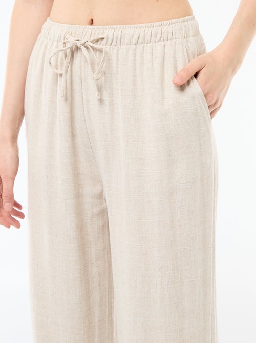Pantalon large femme en lin à taille élastiquée - Kiabi Pantalon large femme en lin à taille élastiquée - Kiabi