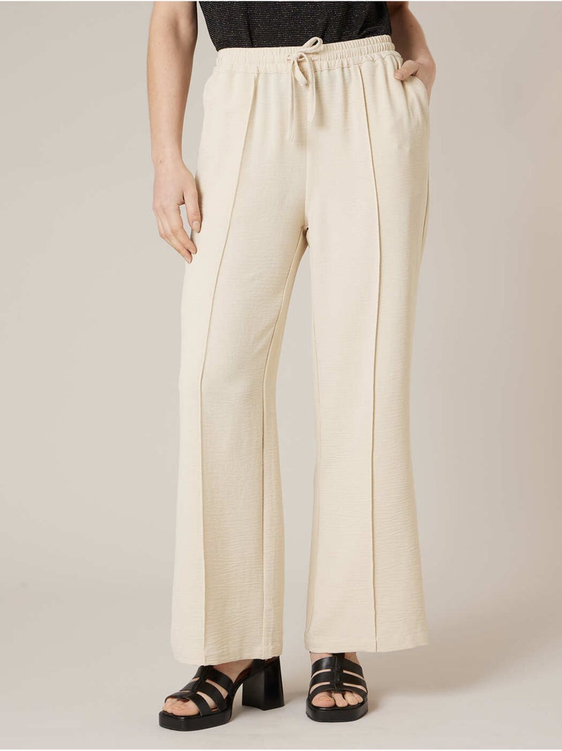 Pantalon large femme en matière fluide 'Deeluxe' Beige - Kiabi
