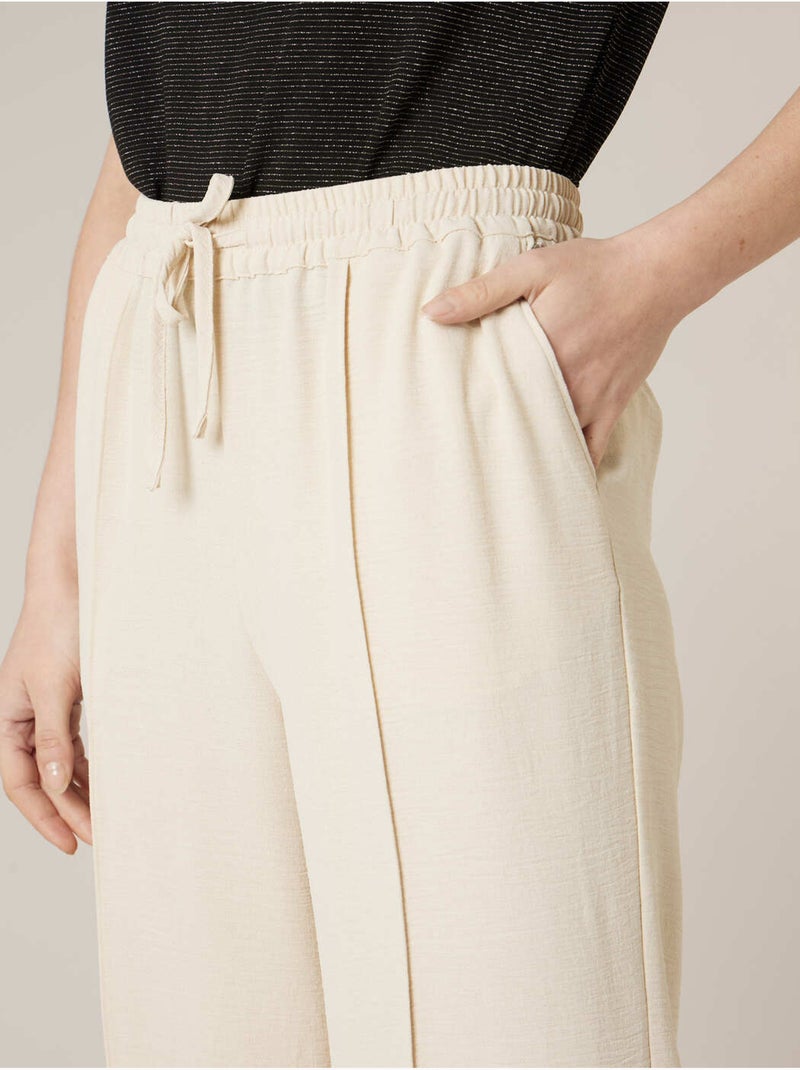 Pantalon large femme en matière fluide 'Deeluxe' Beige - Kiabi