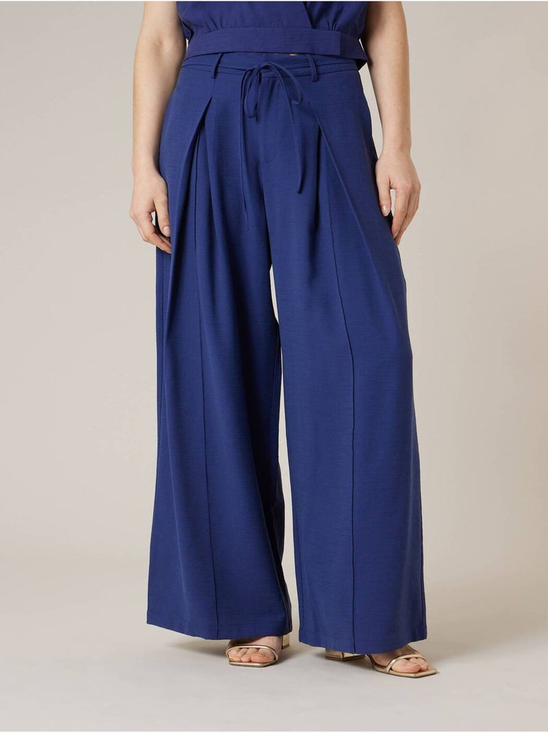 Pantalon large femme en matière fluide 'Deeluxe' Bleu marine - Kiabi