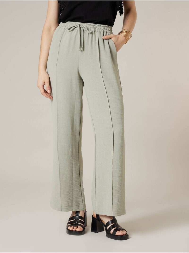 Pantalon large femme en matière fluide 'Deeluxe' Vert tilleul - Kiabi
