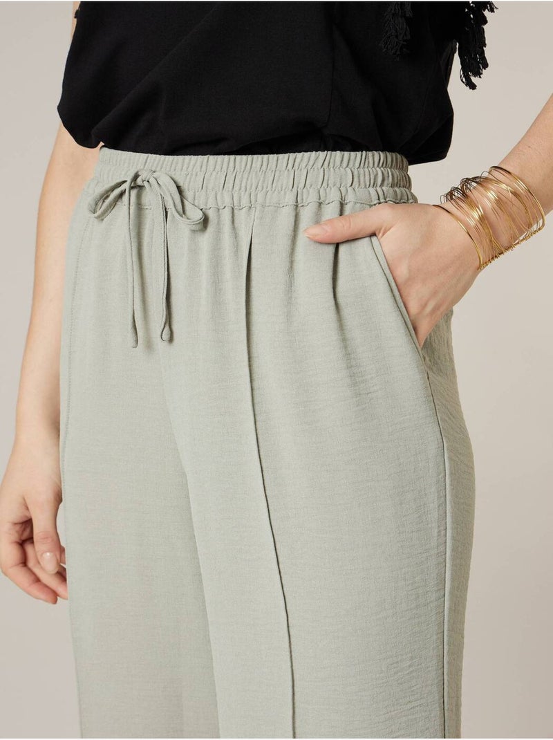 Pantalon large femme en matière fluide 'Deeluxe' Vert tilleul - Kiabi