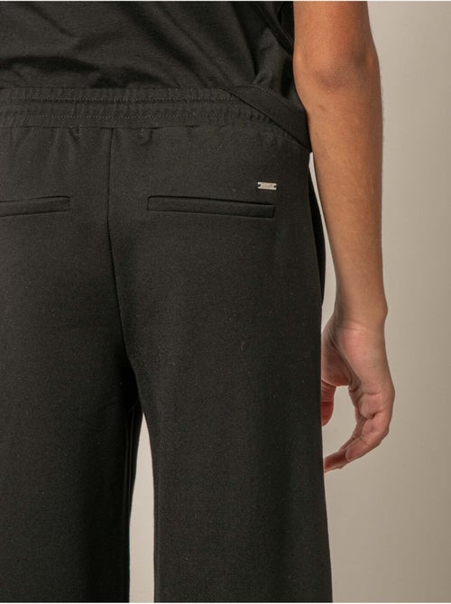 Pantalon large fille en interlock 'Deeluxe' - Kiabi