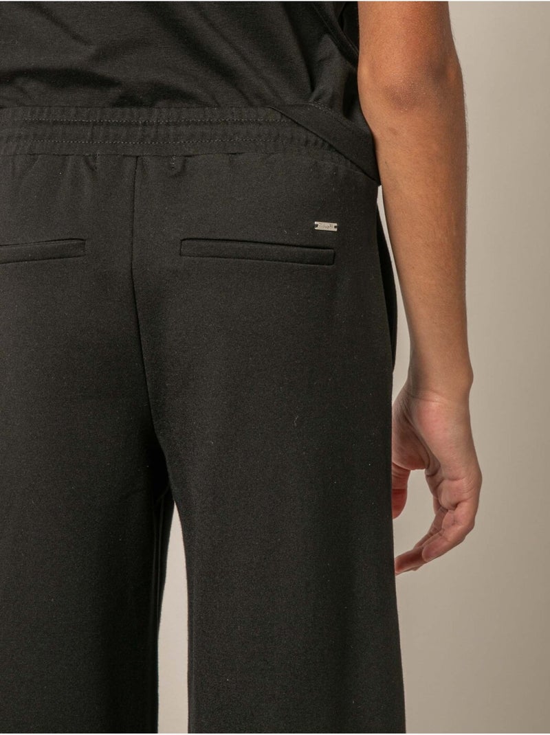Pantalon large fille en interlock 'Deeluxe' Noir - Kiabi