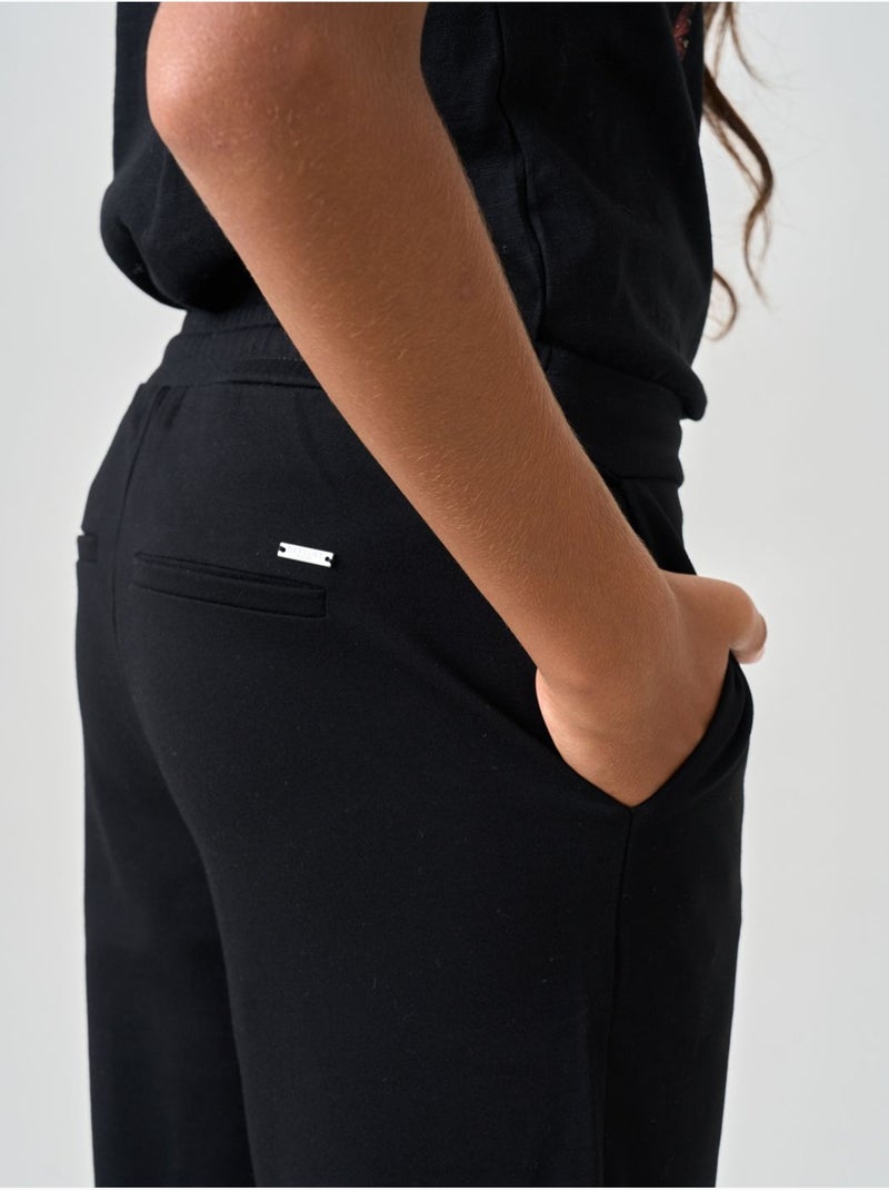 Pantalon large fille en maille interlock 'deeluxe' Noir - Kiabi
