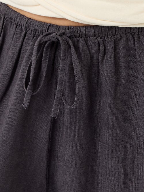 Pantalon large pour femme à taille haute en tissu léger - Kiabi Pantalon large pour femme à taille haute en tissu léger - Kiabi
